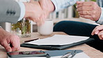 People, buyers and real estate agent with handshake in new home for property sale, transfer or success. Offer, realtor or shaking hands with clients for bond application, house approval or investment