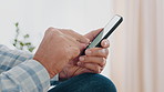 Senior, person and hands with phone in home for social media app, connection or network. Elderly, user or scrolling on mobile smartphone for online browsing, network connectivity or research in house