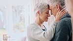 Senior, happy couple or dancing with hug in home for love, romance or anniversary together. Elderly, man or woman with forehead touch, embrace or comfort for romantic relationship or bonding in house