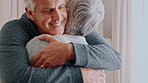 Senior, happy couple and love with hug in home for relationship, compassion or loyalty. Elderly, man and woman with smile, embrace or romance for comfort, anniversary or care together in house