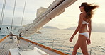 Walking, ocean and back of woman on sailboat for travel adventure, summer holiday and bikini. Deck, person and sightseeing on yacht for seaside vacation, getaway journey or explore on tropical cruise