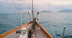 Boat, pier and sailing on ocean water for travel, island destination or outdoor adventure in nature. Empty, ship and cruise with dock or view for tourism, sightseeing or holiday journey on sea trip