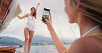 Happy women, boat and picture with phone on sea for holiday memory, vacation or trip together. Female people, friends or photography with mobile smartphone on ship for ocean travel or capture moment