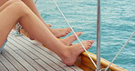 Travel, ship and ocean with legs on yacht for cruise, summer vacation and transportation. Tropical getaway, sailing and adventure with people on boat outdoor for seaside trip, voyage and holiday