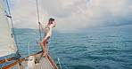 Holiday, woman and travel with VR headset on yacht for sailing simulation, AR sightseeing or trip. Space, girl or 3D glasses on boat for interactive cruise, metaverse or immersive vacation experience