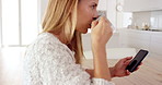 Phone, reading and woman in kitchen, drinking coffee or check morning news on website. Home, beverage or person with mobile for social media story, scroll blog and browsing article on internet