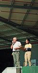 Logistics, people and outdoor by warehouse with radio, clipboard and talk for shipping instructions. Manager, team and tech at depot with contact, checklist and collaboration for supply chain update.