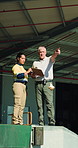 People, pointing and clipboard for logistics outdoor for shipping, loading dock and dispatch route. Team, checklist and instructions for cargo coordination, delivery information and safety compliance