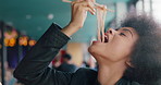 Woman, eating and food with chopsticks at restaurant for reunion, ramen noodles and bonding. Smile, people and hungry with friends for dining together, spaghetti meal and Japanese cuisine for lunch