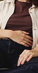 Woman, hands and sick with stomach ache, menstruation cramps and discomfort from indigestion problem. Female person, abdominal pain and inflammation with period cycle, health issue or medical crisis.