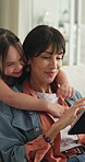 Relax, tablet and hug with mother and daughter on sofa in home for streaming, love and bonding. Movie subscription, support and media search with woman and child in living room of family house