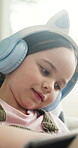 E learning, headphones or kid in house with tablet, online activity or project on academic platform. Homeschool, tech or child on sofa with homework, digital lesson or assessment in remote education.