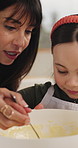 Baking, mom or daughter in home with mixing, bonding or support in learning to cook. Help, woman or child with dessert preparation, healthy relationship or family connection for cognitive development