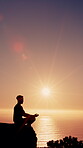 Zen, mindfulness and man at beach for meditation, outdoor or calm with inner peace on summer holiday. Ocean, silhouette and person in nature for mantra, mental health and flare on vacation for break