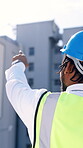 Pointing, engineer and back with black man in city for construction site, view and contractor. Building inspection, reflection and architecture adviser with person outdoor for project renovation