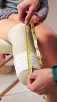 Hands, physiotherapist and measure leg of amputee for fitting, prosthetic limb and rehabilitation. Physio, tape and patient with disability for socket design, medical assessment and correct length