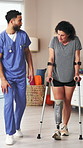 Physiotherapist, amputee and explain with people, walking and rehabilitation for person with disability. Advice, recovery or consultation for medical prosthetic, physical therapy or man with woman