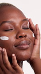 Smile, face cream or woman with skincare in studio, collagen moisturizer or glow treatment product. Lotion, dermatology or black person with hydration for smooth skin, beauty or white background