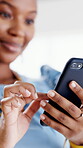 Typing, hands or business woman with phone in office, monitor campaign engagement or review feedback. Scroll comments, smile or social media manager with tech for planning, trend research or reading