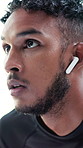 Thinking, outdoor and man with earphones for fitness, training and exercise for wellness, health or cardio. Runner, athlete and person listening to audio, podcast and music to start active hobby
