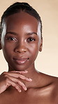 Skincare, touch and face of black woman in studio with natural texture, beauty and wellness. Spa, salon and portrait of person with smooth skin for dermatology, cosmetics or glow on yellow background