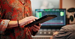 Man, hands and team in music studio with tablet, research trends and website for song inspiration. Coworking, person and typing with tech for creativity, record label or download app for album ideas.