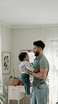 Love, lift and father with baby in home, interracial family and playing together for weekend bonding. Adoption, single parent and happy man with boy for security, support and connection for fun
