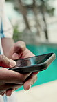 Hands, phone and holiday with pool for travel, weekend and scroll break. Hotel, summer vacation and person with tech for influencer, social media and connection with app and luxury resort review