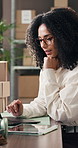 Boxes, laptop and thinking with woman in logistics plant for management of shipping schedule. Computer, reading and typing with employee person in supply chain office for delivery or distribution