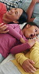 Above, parents and kids laughing in bedroom for peace, playful morning and bonding together. Smile, people and children with laughter for funny games, family connection and weekend break at house