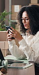 Boxes, phone and typing with woman in logistics plant for management of shipping schedule. Mobile, reading and text message with employee person in supply chain office for delivery or distribution