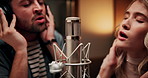 Microphone, singers and people in studio with headphones for recording music, song or album. Musicians, creative talent and man with woman singing for production of audio together in sound booth.
