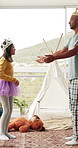 Fantasy, father or child with costume in home, make believe or role play for creativity development. Bonding, dress up and man with happy daughter for princess game, laughing and imagination support