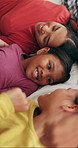 Happy, parents and rest with children in bedroom for peace, calm morning and bonding together. Smile, people and laughing with kids for weekend break, family connection and comfortable for wellness