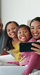 Funny face, selfie and parents with kids in bedroom for love, care or memory on social media. Mother, father and profile picture in bed with children at home for photography, goofy or family bonding