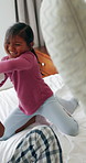 Family, children and pillow fight in bedroom with energy, playful morning and bonding together. Parents, laughing and playing games with kids for fun, weekend break and pajamas for holiday activity