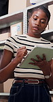 Tablet, stylus and black woman in office with boxes for delivery, logistics and ecommerce order. Digital technology, pen and African female supply chain manager with online shipping information.