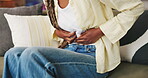 Woman, hands and massage on couch with stomach ache, menstruation cramps or discomfort from indigestion. Sick, female person and abdomen pain in home with period cycle, health issue or medical crisis