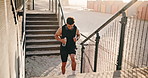 Fitness, man or running on stairs at beach for HIIT workout, endurance challenge or burning calories. Water, athlete or training on steps outdoor for athletic performance, exercise routine or stamina