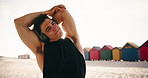 Stretching, fitness and music with man at beach for workout start, health radio and streaming. Warm up, training podcast and headphones with person outdoor for runner, wellness and challenge