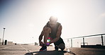 Athlete, man and tie laces in city for fitness, endurance training and running preparation. Flare, male person and exercise safety with footwear, getting ready and sports workout for wellness outdoor