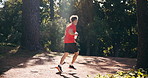 Running, athlete and man in nature for fitness, cardio and training routine for wellness or exercise. Outdoor, runner and person with endurance for workout, healthy and physical activity at park