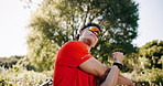 Fitness, sunglasses or man with stretching outdoor to start exercise, muscle preparation or wellness. Low angle, runner or eyewear with arm warm up in nature for workout, flexibility or getting ready
