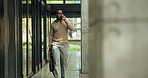 Businessman, walk and talk in city with phone call, property listing confirmation or real estate job. Realtor, black person and commute outdoor by building with tech, contact or housing market update