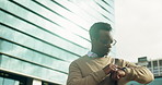 Businessman, walk or check smart watch in city with direction, notification or real estate appointment. Low angle, black person or realtor downtown with tech, time or digital map for property listing