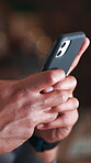 Texting, hands and employee with smartphone in business, online and message on social media at night. Person, working late and communication with contact on mobile app, typing and digital chat on web