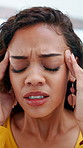 Pain, headache and woman in home with stress for mental crisis, tension or pressure for debt. Migraine, person and massage temples in house with brain fog, fatigue or tired with financial challenge