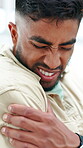 Hurt, man and stress in office with shoulder pain, muscle inflammation and symptoms for work burnout. Tired, person and employee in business with bad posture, fatigue and suffering from fibromyalgia.