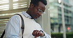 Watch, waiting and bus stop with business black man in city for time management, travel schedule or check. Transit delay, appointment and commute with person outdoor for downtown, morning and journey