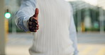 Handshake gesture, deal and businessman in city for meeting, agreement or welcome for partnership. Professional, greeting and male employee with shaking hands for negotiation or thank you in town.